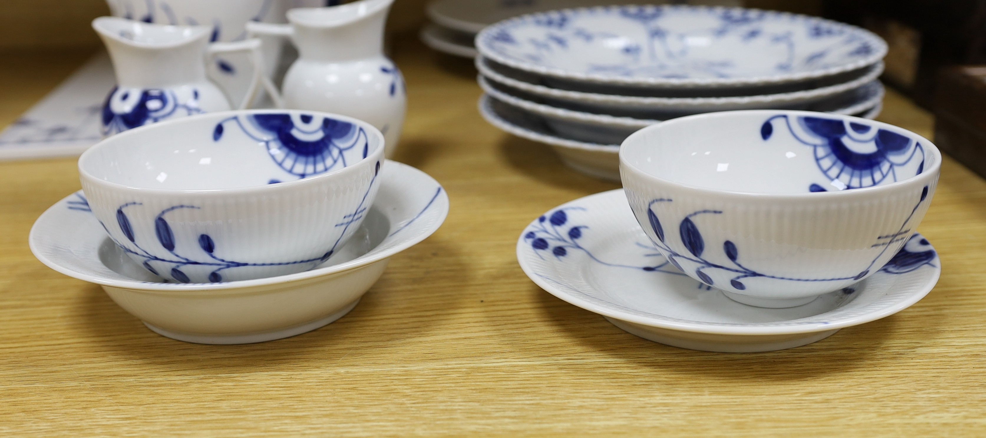 A collection of varying patterns of Royal Copenhagen blue and white tableware